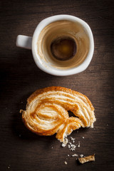 Palmiers sweet and empty coffee cup
