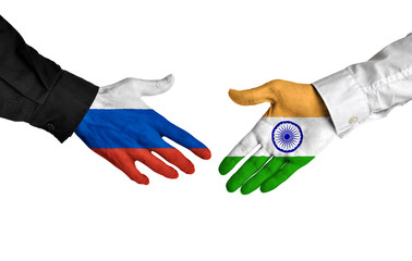 Russia and India leaders shaking hands on a deal agreement