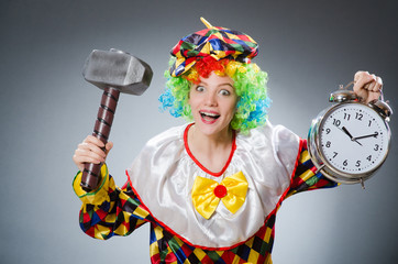 Clown with hammer and clock