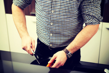 Man cooking in kitchen at home.