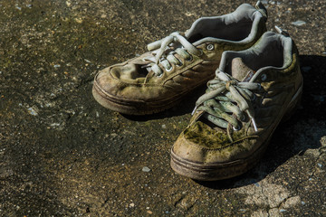 old shoes on grunge cement floor