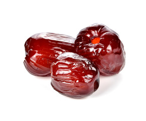 Jujube in syrup on white background.