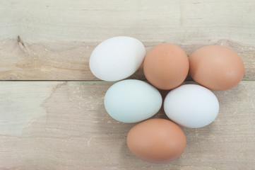 Still Life- eggs laid on a wooden floor.