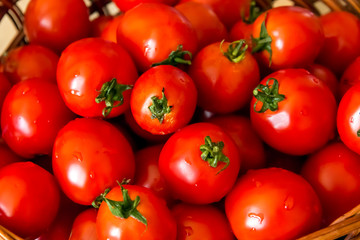 Heap of Fresh Red Tomatoes with Green Tails Top View Seasonal Autumnal Composition