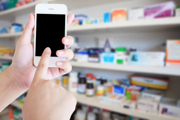 Fototapeta na wymiar pharmacist hand holding smart phone