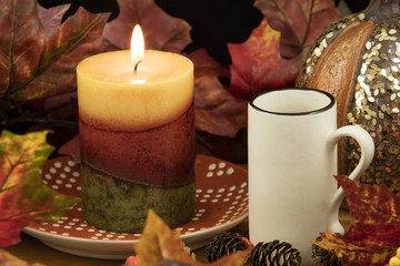 Coffee, Lit Candle and Pumpkin Decor