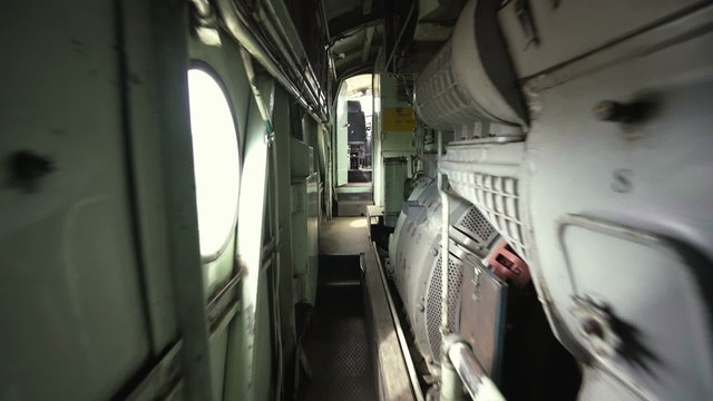 Walking inside the engine room of a locomotive, shot with gimbal stabilizer