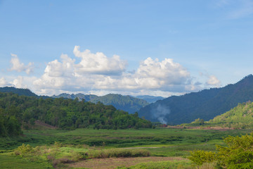 Forest-covered mountains around