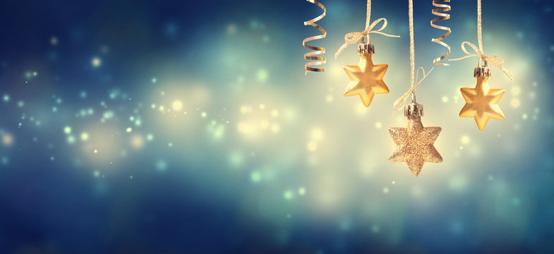Christmas golden star ornaments at night