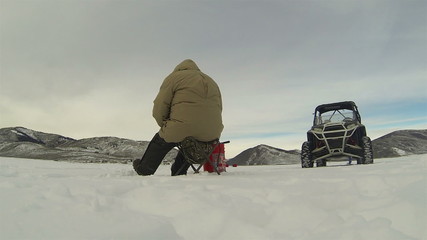 Ice fishing high mountain frozen lake winter HD 0230