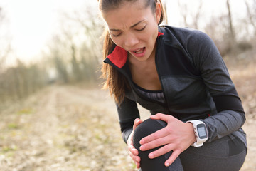 Sports injury - Running fit woman with knee pain