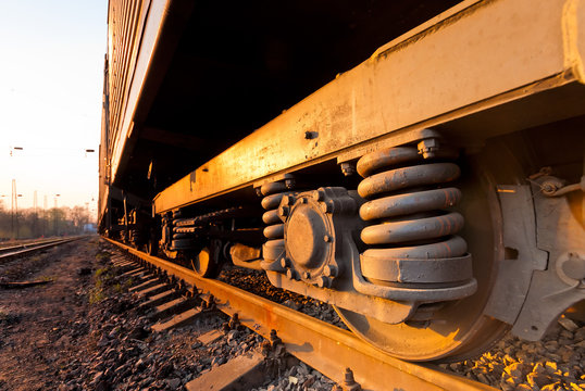 Fototapeta Rusty old wheel of a freight train standing on the tracks