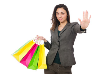 Attractive woman with shopping bags isolated on white