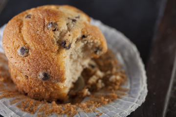 Chocolate muffin on a wooden background