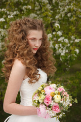 Naklejka premium Young bride with flowers