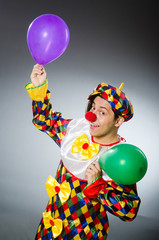 Obraz na płótnie Canvas Funny clown in comical concept