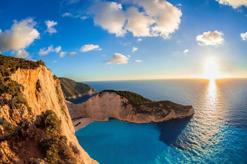 Navagio beach with shipwreck against sunset, Zakynthos island, Greece