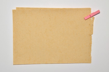 Recycled paper with pink clipper
