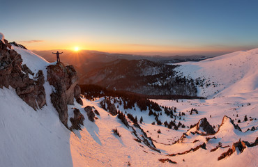Fototapeta premium Man on top as silhouette in mountain