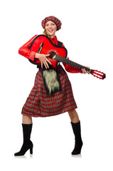 Funny woman in scottish clothing with guitar