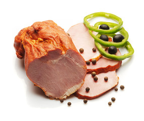 Ham decorated with green Bulgarian pepper over white background