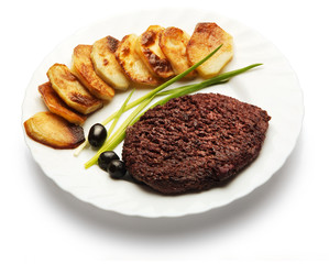Roast meat decorated with onion, olive, and potato over white background