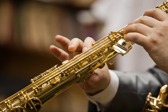 Hand of musician playing the soprano saxophone