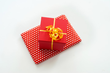 Red gift box with ribbon isolated on white background.