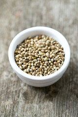 hemp seeds on wooden surface