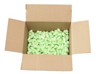 cardboard box with green packing foam pellets top view