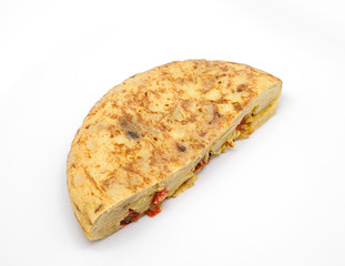 Spanish omelette with olive oil and red pepper isolated on white