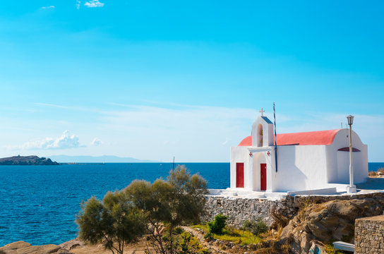little greek orthodox chapel at the beach in mykonos, greece