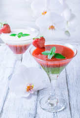 Fresh fruit and berry cocktail  on shabby wooden boards and whit