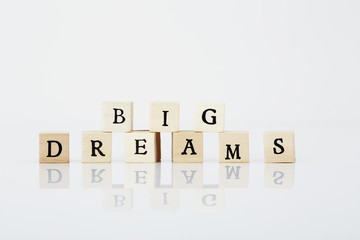 Tiles spelling 'Big dreams' against white background