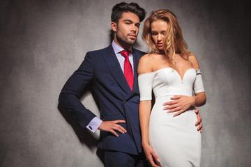 embraced elegant fashion couple standing in studio