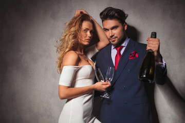 sexy elegant couple with botle of champagne