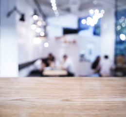 Table top with Blurred People with Cafe Shop interior background
