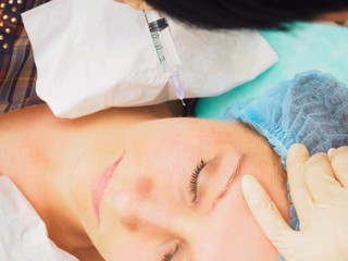 Obraz na płótnie Canvas Cosmetology procedure mesoteraphy. Rejuvenation revitalization, skin nutrition, wrinkle reduction. Doctor making microneedle injection.