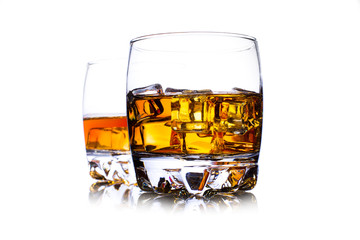 Glass of whiskey with ice isolated on white
