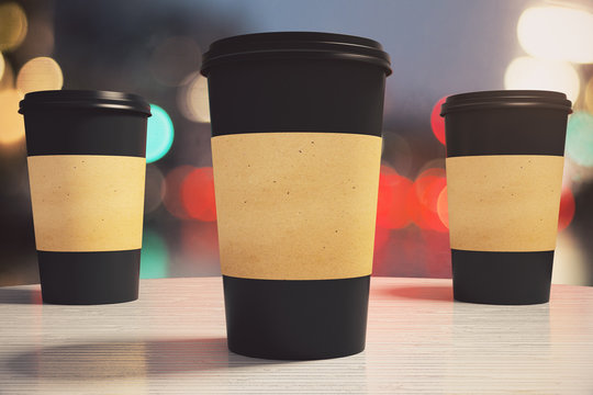 Three Black Paper Coffee Cup On A Table In A Cafe, Mock Up