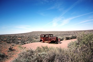Route 66 rusted Car in Petrified Forest National Park in Arizona, USA