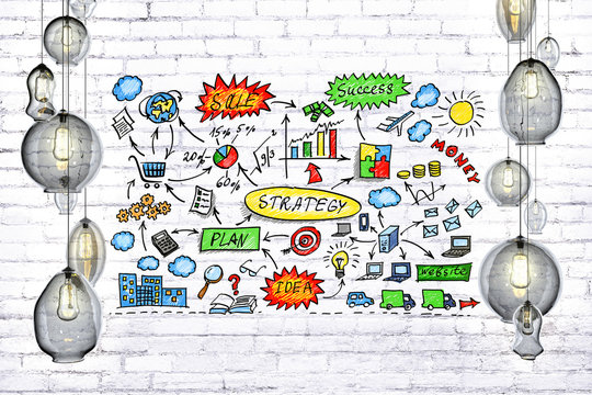 Strategy idea concept with lightbulbs and bricket wall