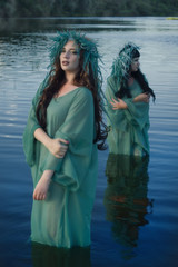 Obraz premium Two mermaids on the lake