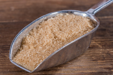 Brown sugar cane in a metal shovel