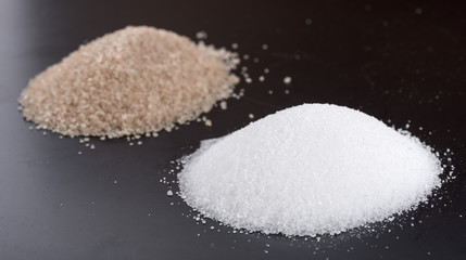 Heaps of white and brown crystal sugar