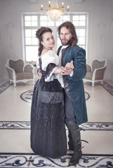 Beautiful couple woman and man in medieval clothes