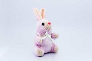 Funny knitted rabbit toy isolated on white background