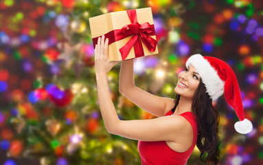 beautiful sexy woman in santa hat with gift box