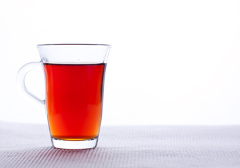 a glass of black tea