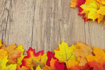 Naklejka na ściany i meble Autumn Leaves and Weather Wood Background